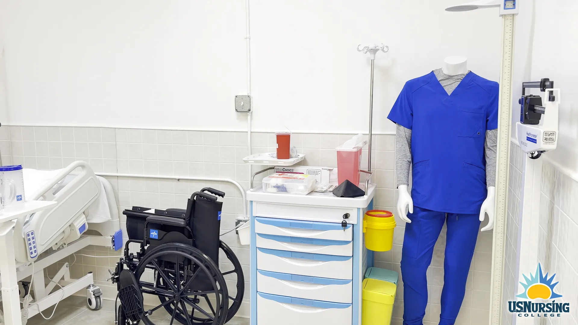 Accessible patient care simulation lab with hospital bed, wheelchair, and medical equipment