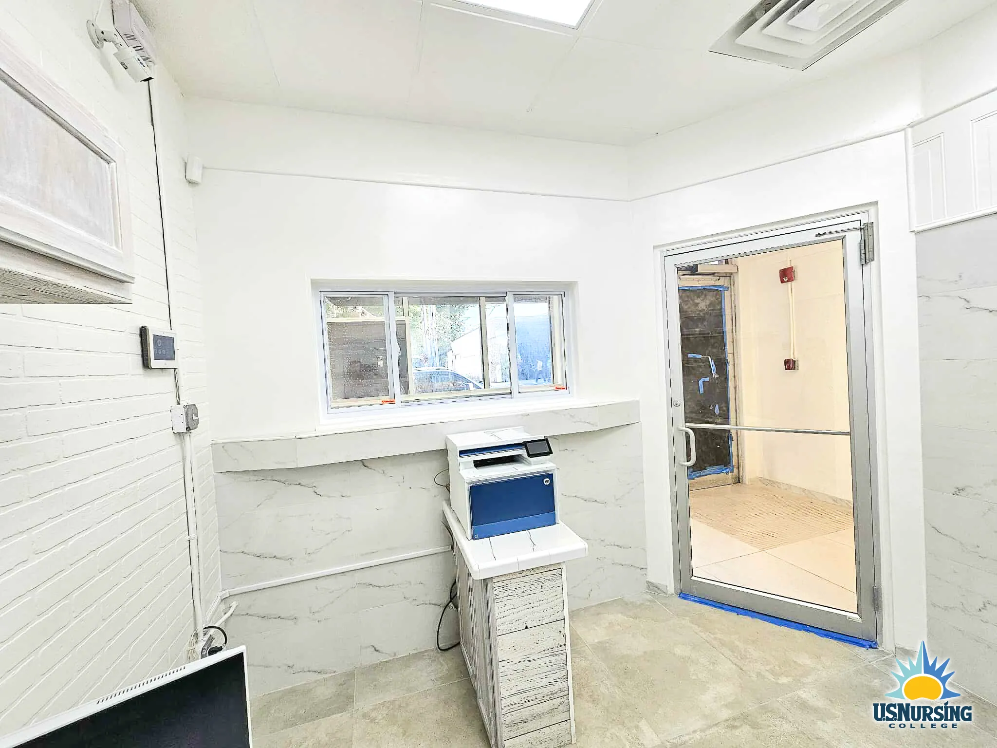 Clinical observation room with workstation and interior viewing window