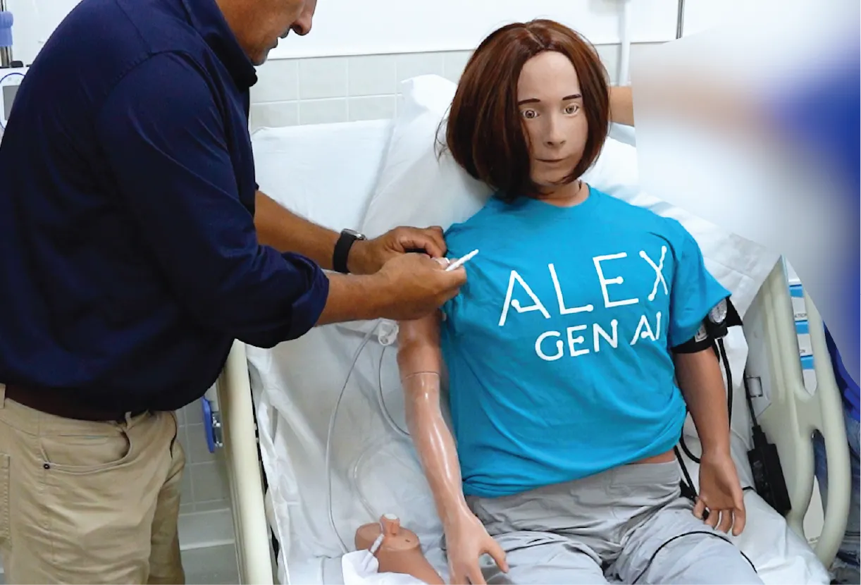 A student training with Alex, USNC's high-fidelity manikin
